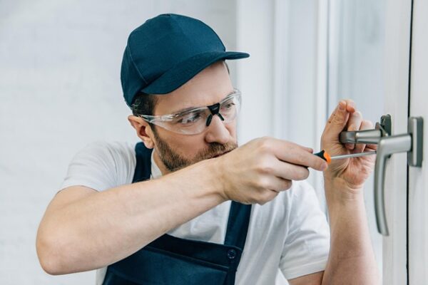A locksmith opening a lock.